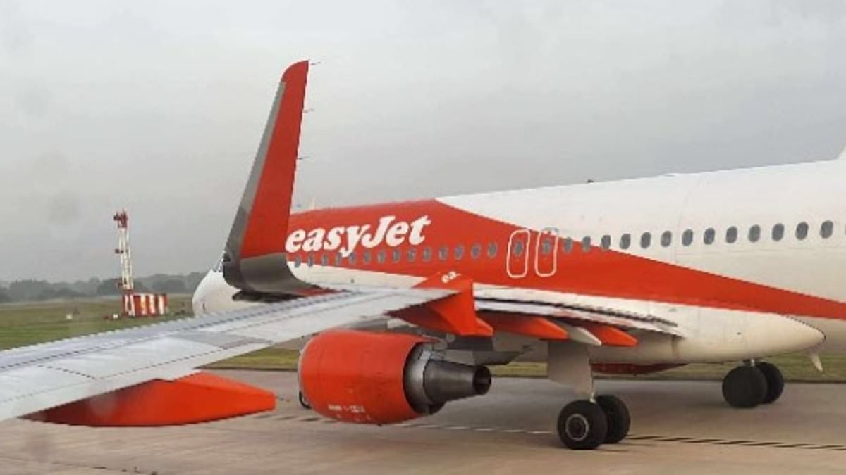 Airport chaos hits Britain yet again as planes 'clip wings' at Manchester Airport and stop ALL flights